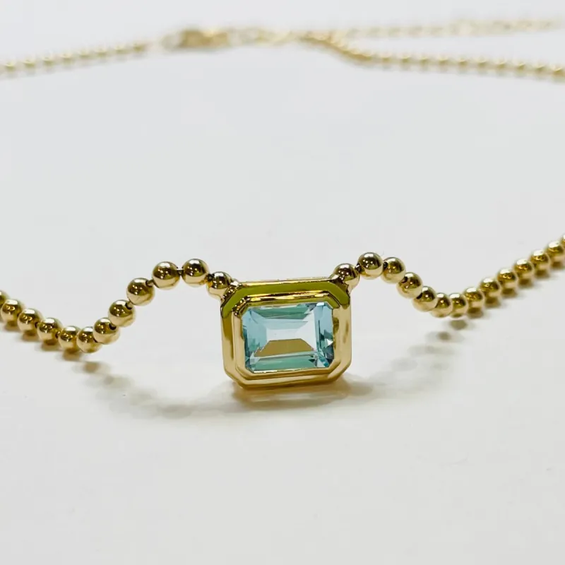 stepped bezel set topaz necklace sold by Theodosia