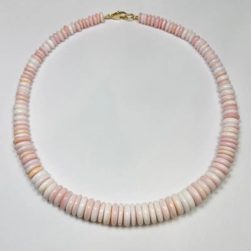 pink conch graduated necklace sold by Theodosia