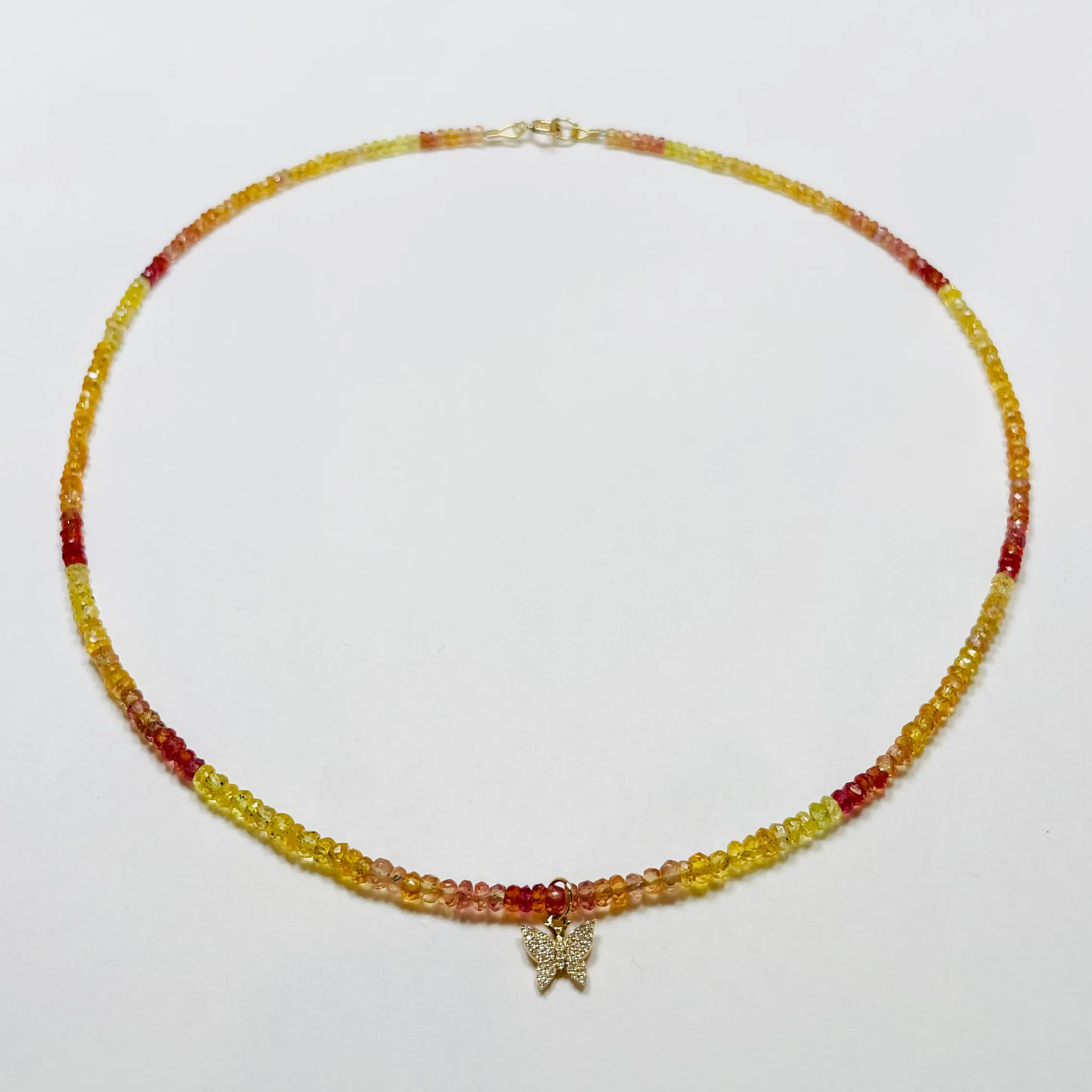 delicate shaded sapphire necklace with diamond butterfly charm sold by Theodosia