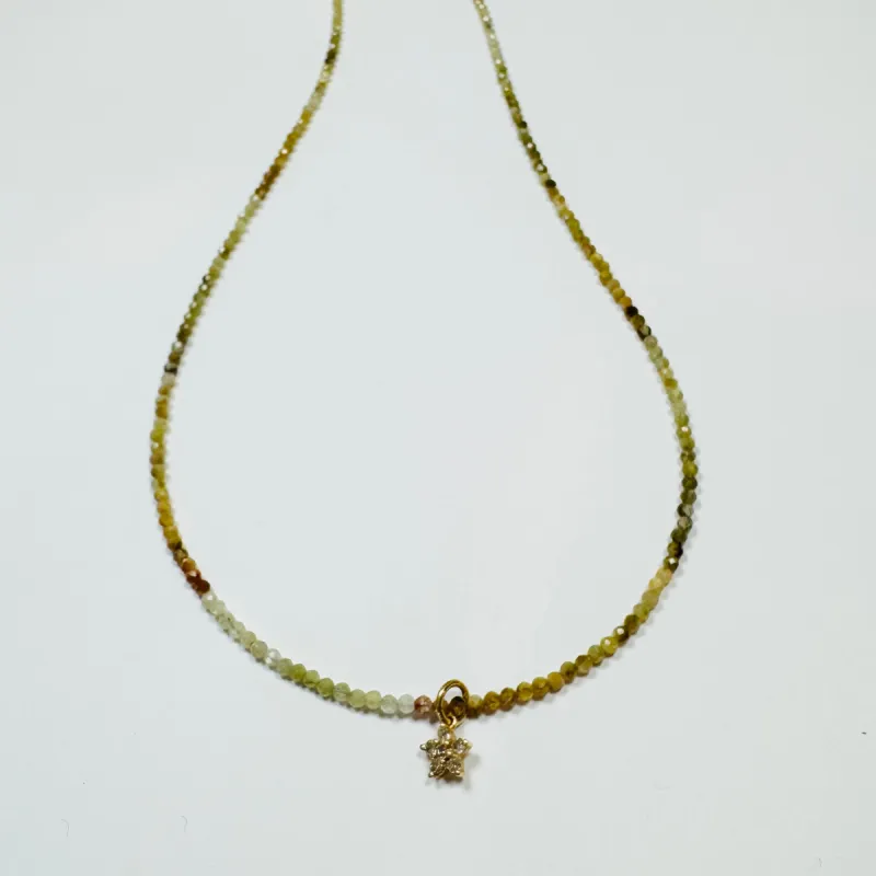 delicate shaded sapphire necklace with diamond flower charm sold by Theodosia