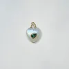 puffy moonstone heart pendant with emerald sold by Theodosia
