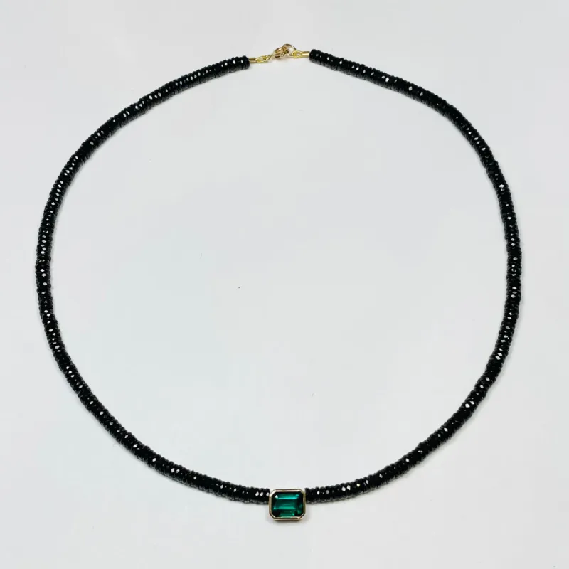 black spinel heishi necklace with bezel emerald sold by Theodosia