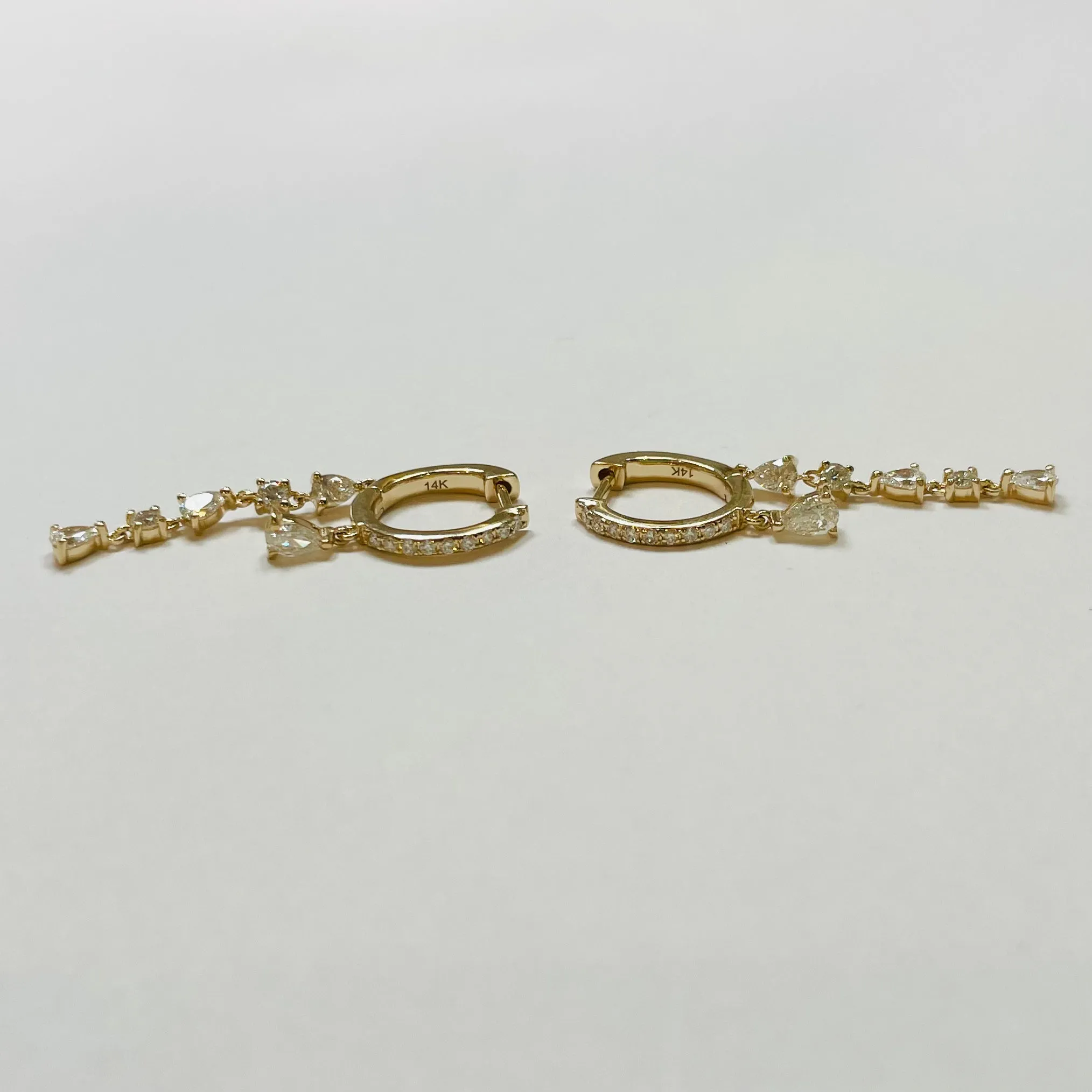 diamond dangle huggies sold by Theodosia