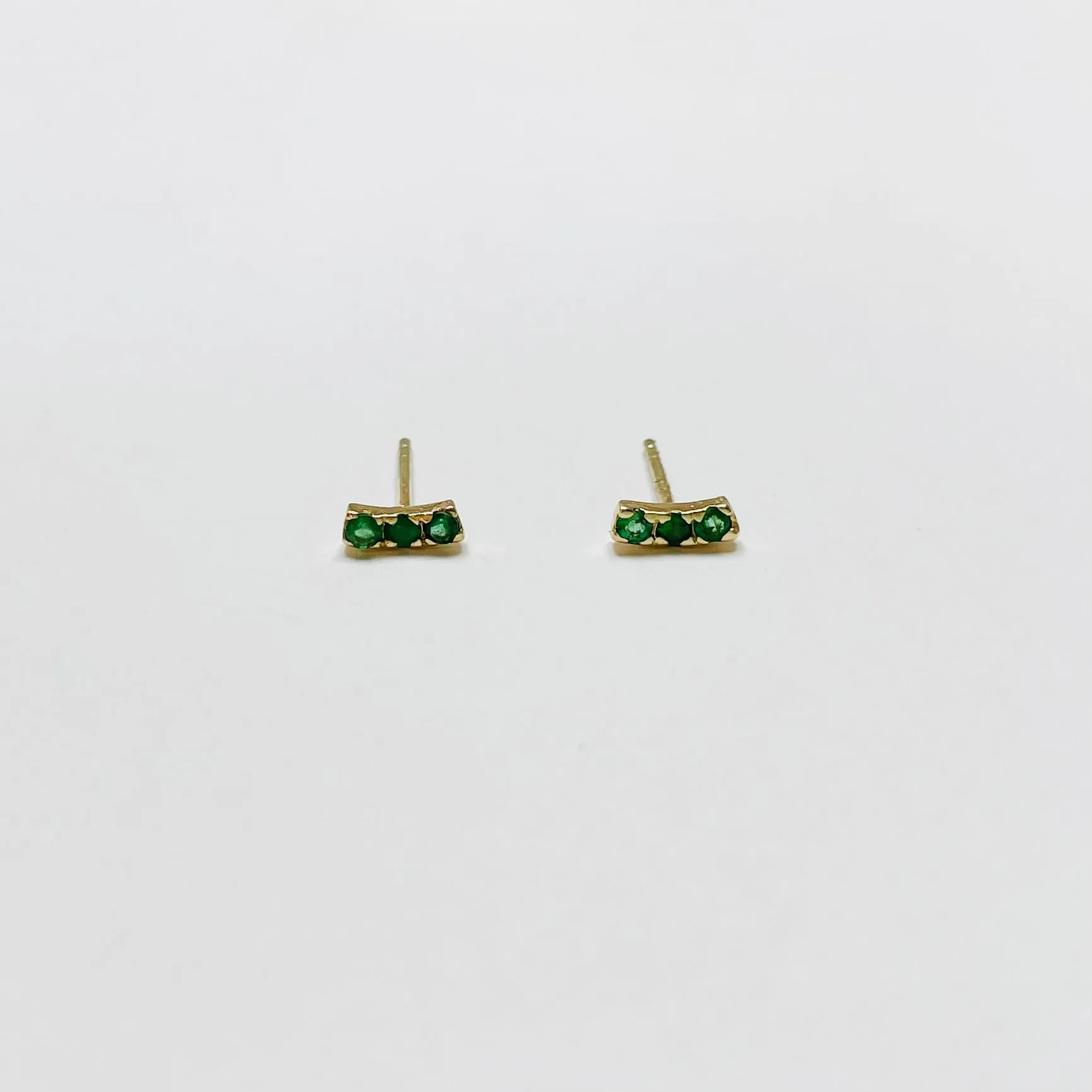 emerald arc studs sold by Theodosia