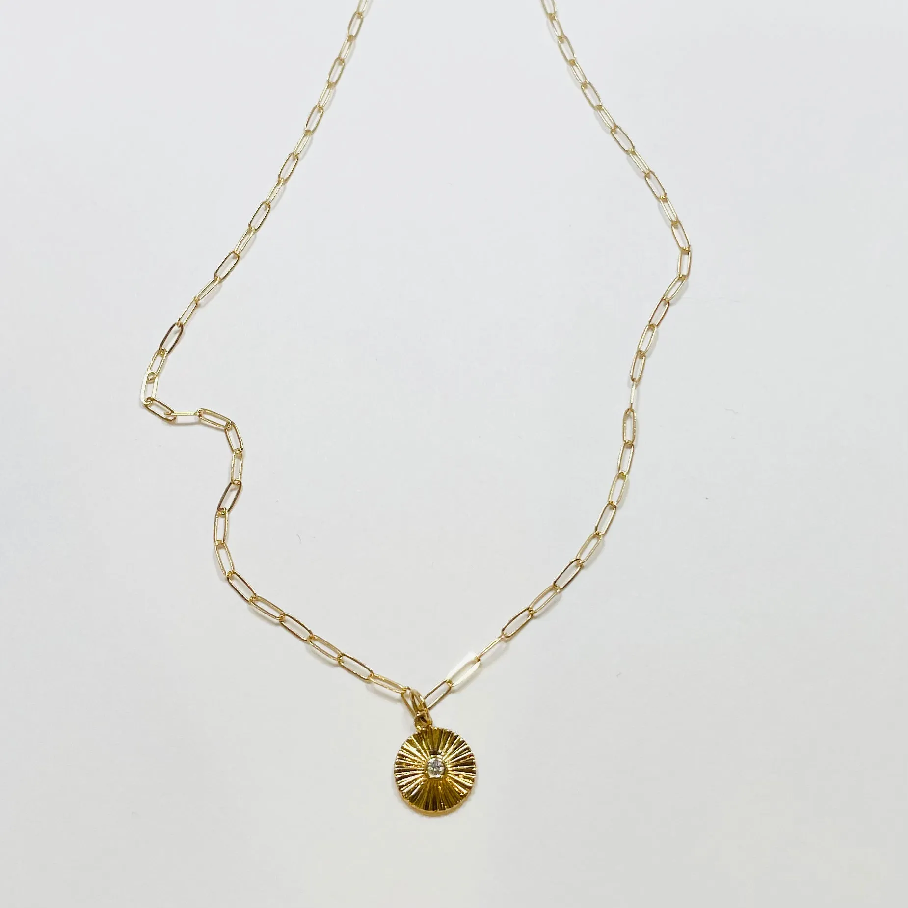 fluted disk pendant necklace sold by Theodosia