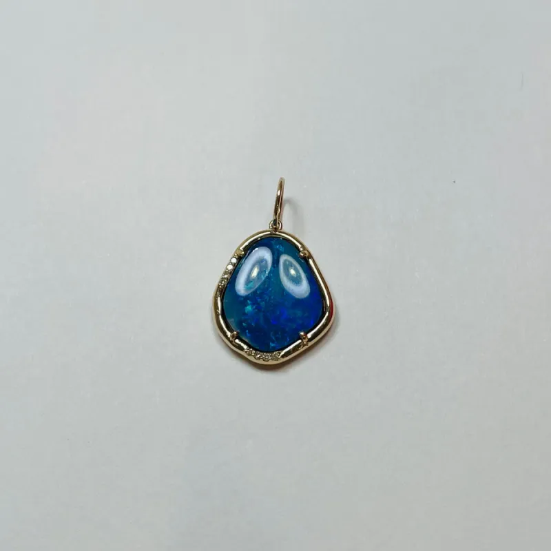 freeform opal with gold bezel and diamonds sold by Theodosia