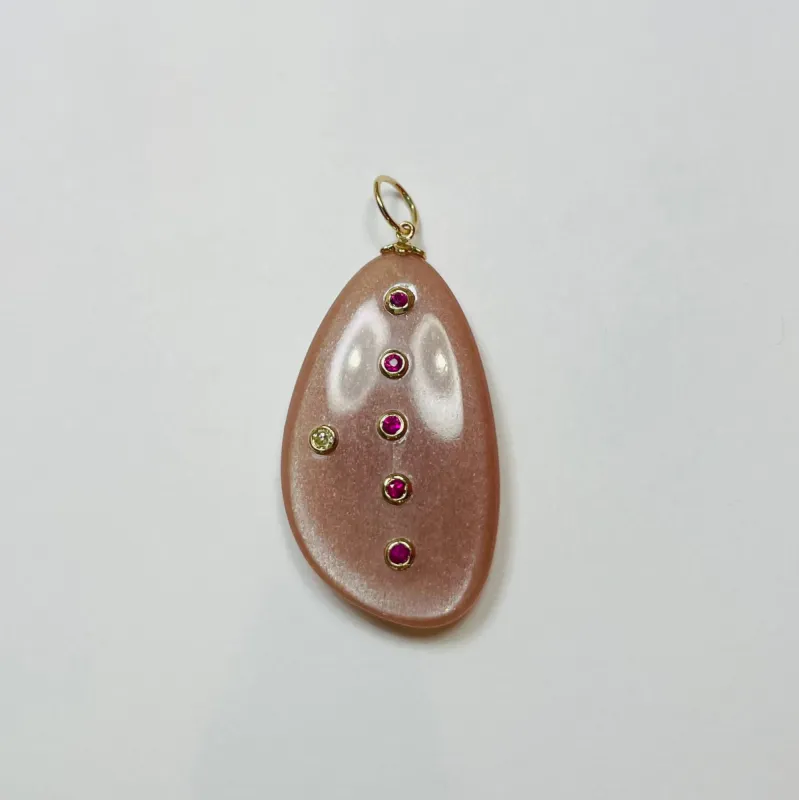 freeform peach moonstone with rubies and diamond sold by Theodosia