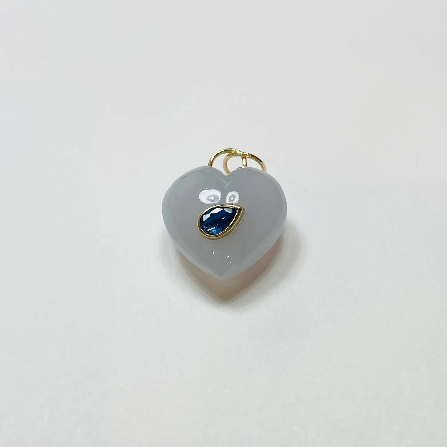 puffy chalcedony heart pendant with blue sapphire sold by Theodosia