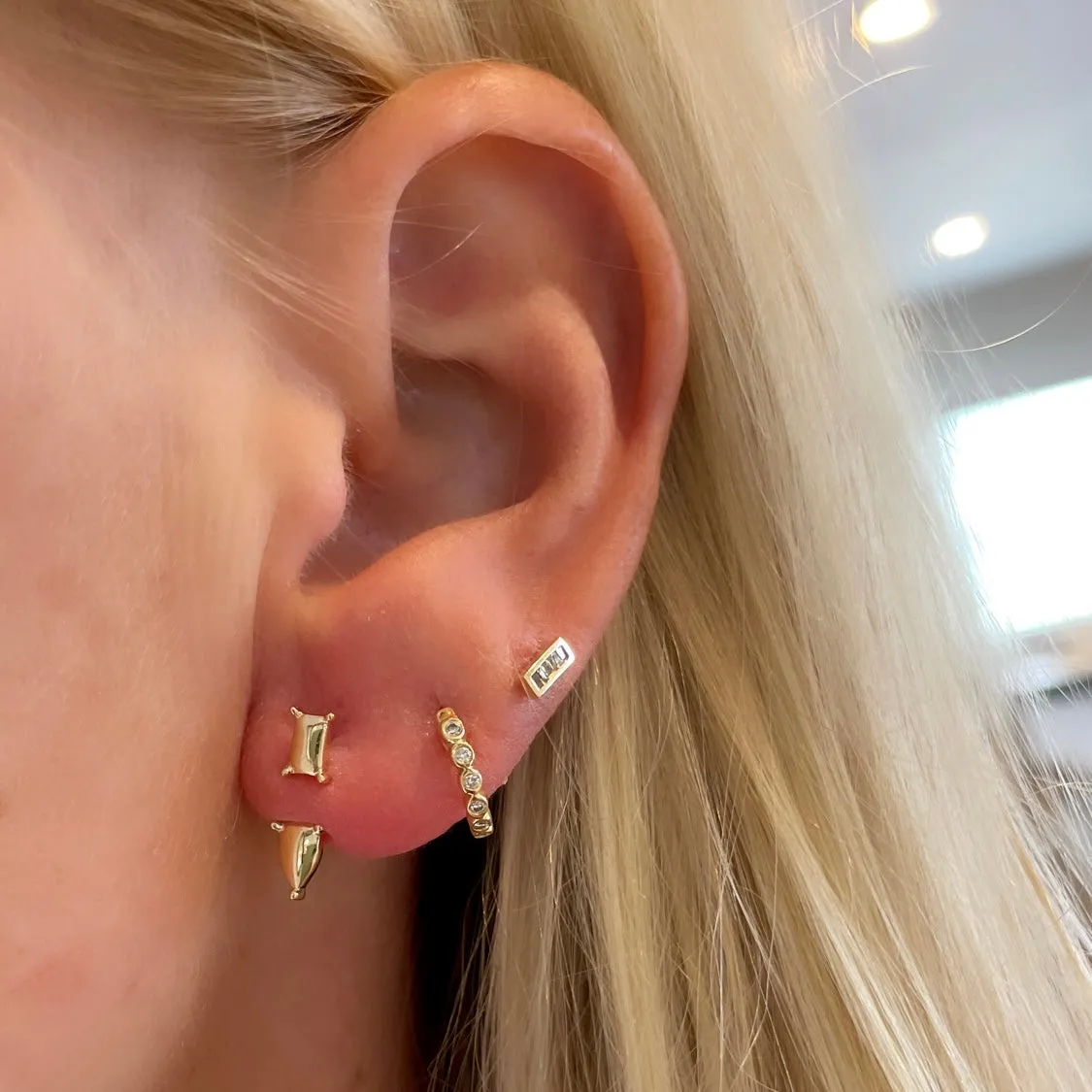 gold studs with jacket sold by Theodosia