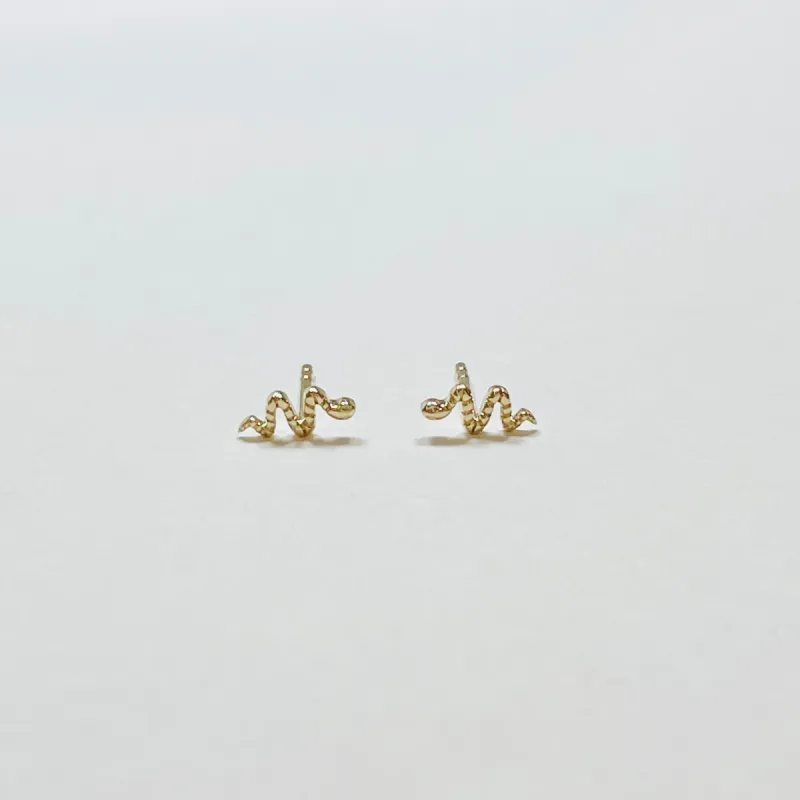 textured snake studs sold by Theodosia