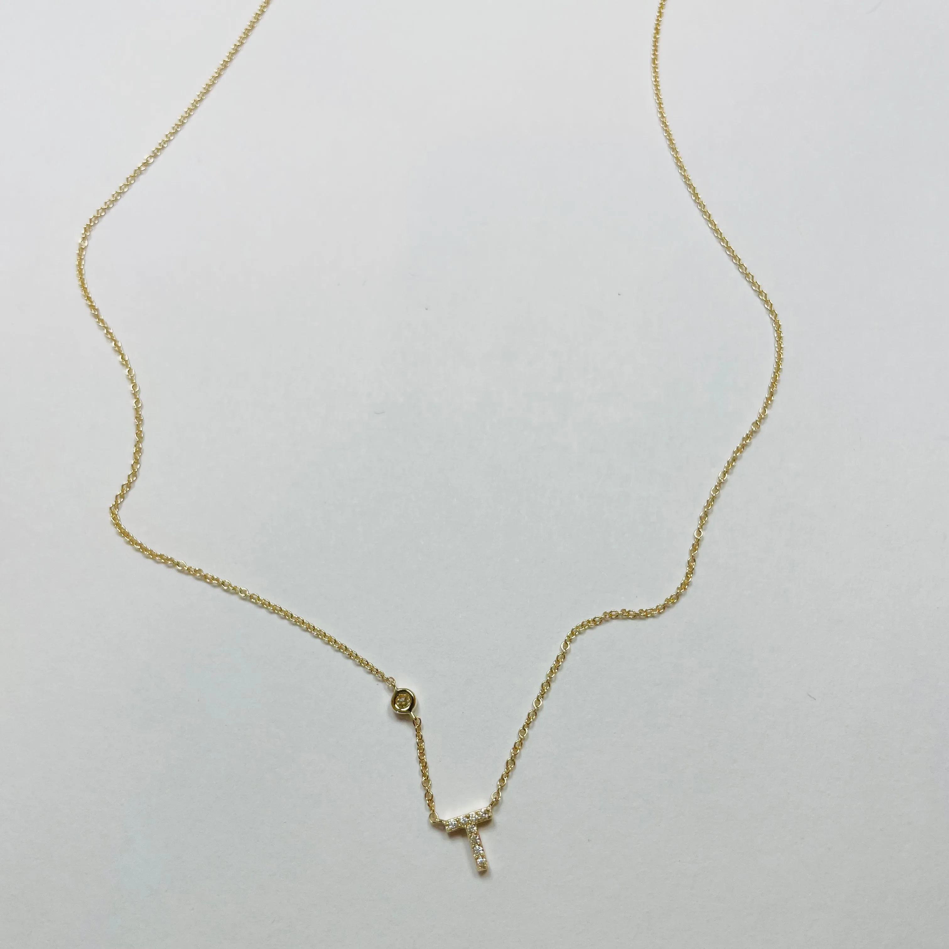 initial pavè diamond necklace sold by Theodosia