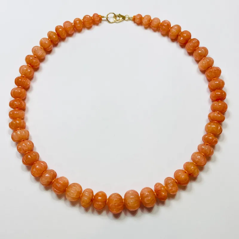 carved tangerine candy necklace sold by Theodosia