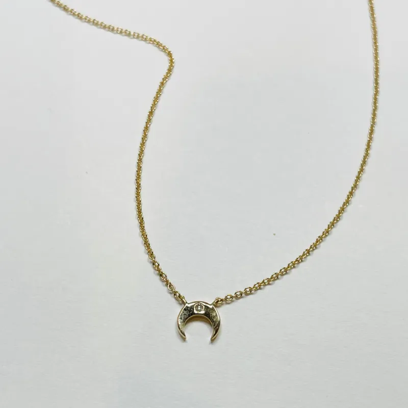 mini crescent necklace sold by Theodosia