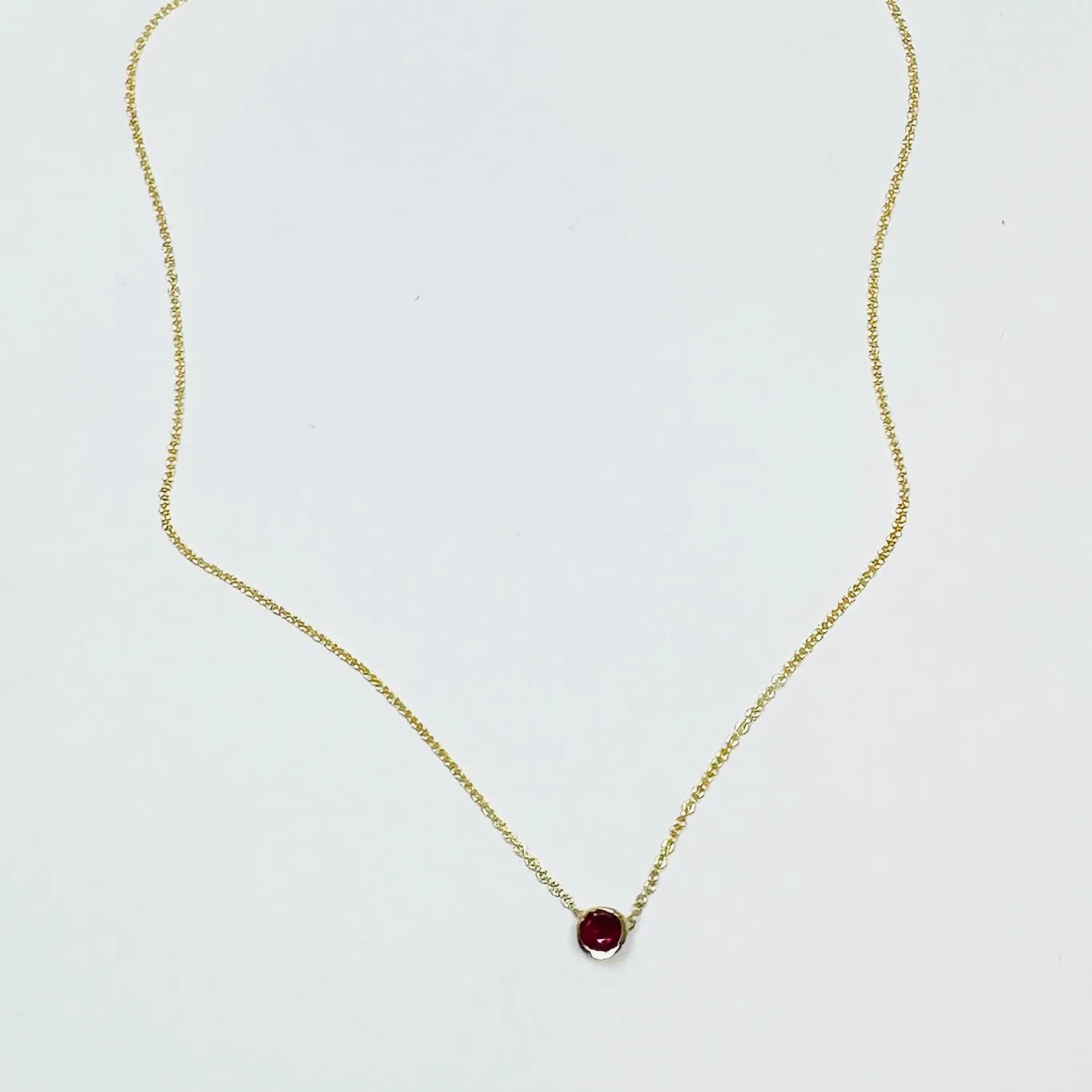 bezel set ruby necklace sold by Theodosia