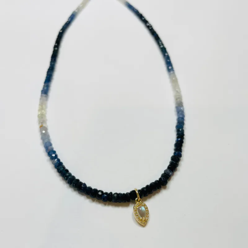 delicate shaded blue sapphire necklace with diamond moonstone charm sold by Theodosia