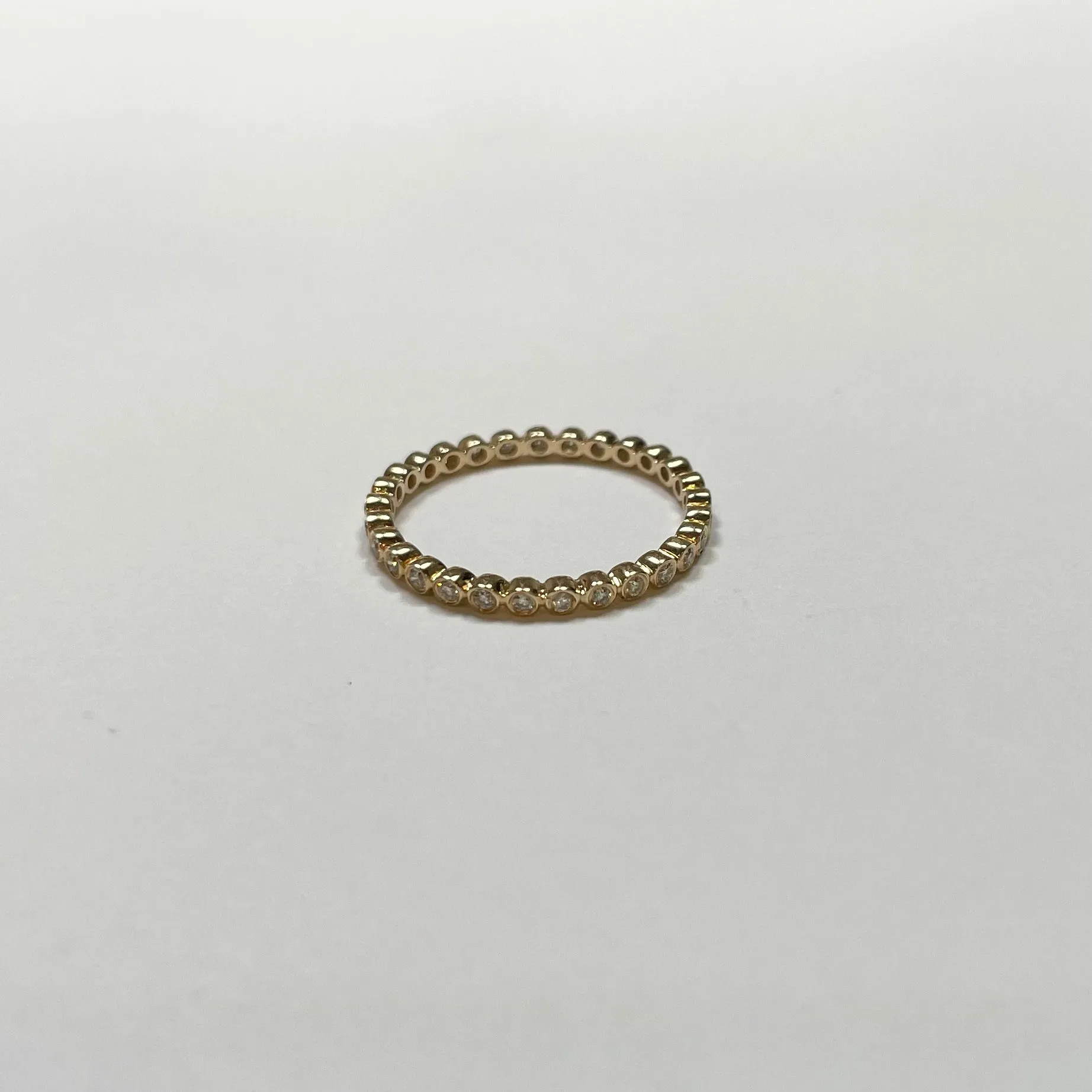 bezel set diamond eternity band sold by Theodosia