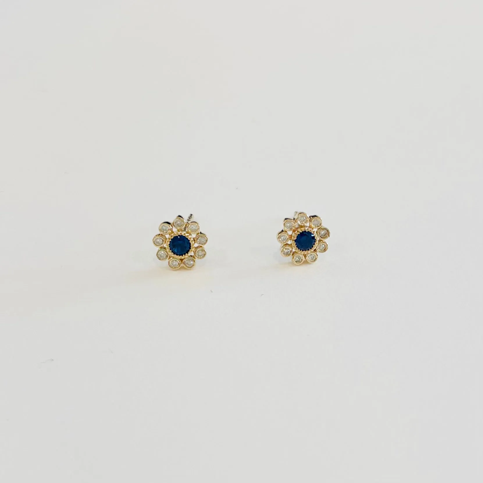 blue sapphire and diamond flower studs sold by Theodosia
