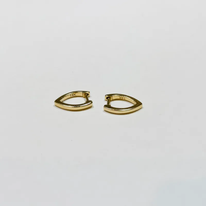 gold pointed huggies sold by Theodosia