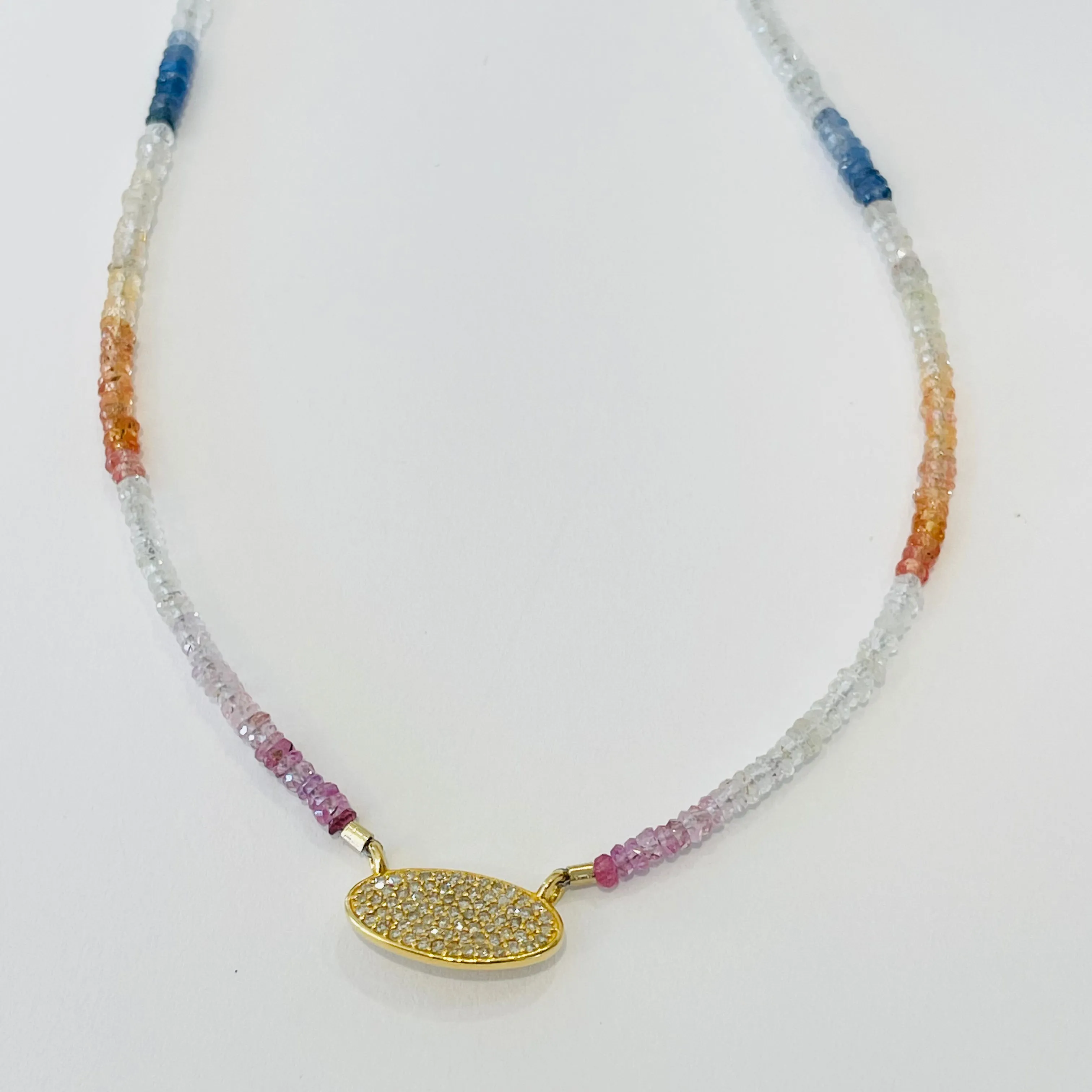 delicate shaded sapphire necklace with pavè diamond disc sold by Theodosia