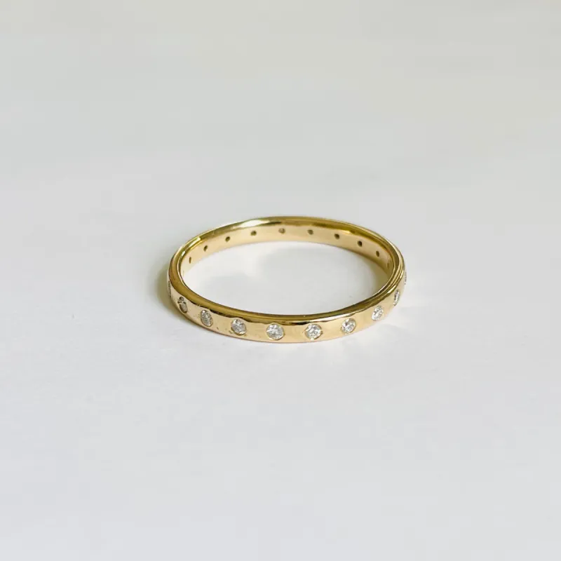 gold band with diamonds sold by Theodosia