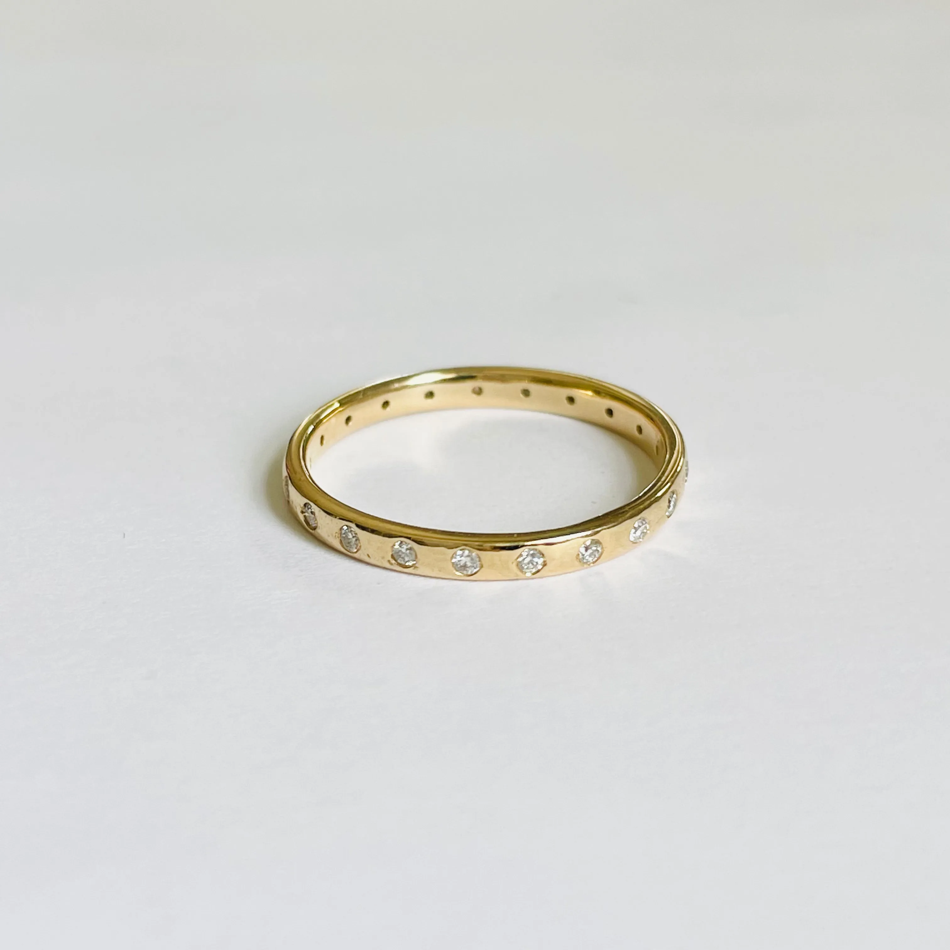gold band with diamonds sold by Theodosia