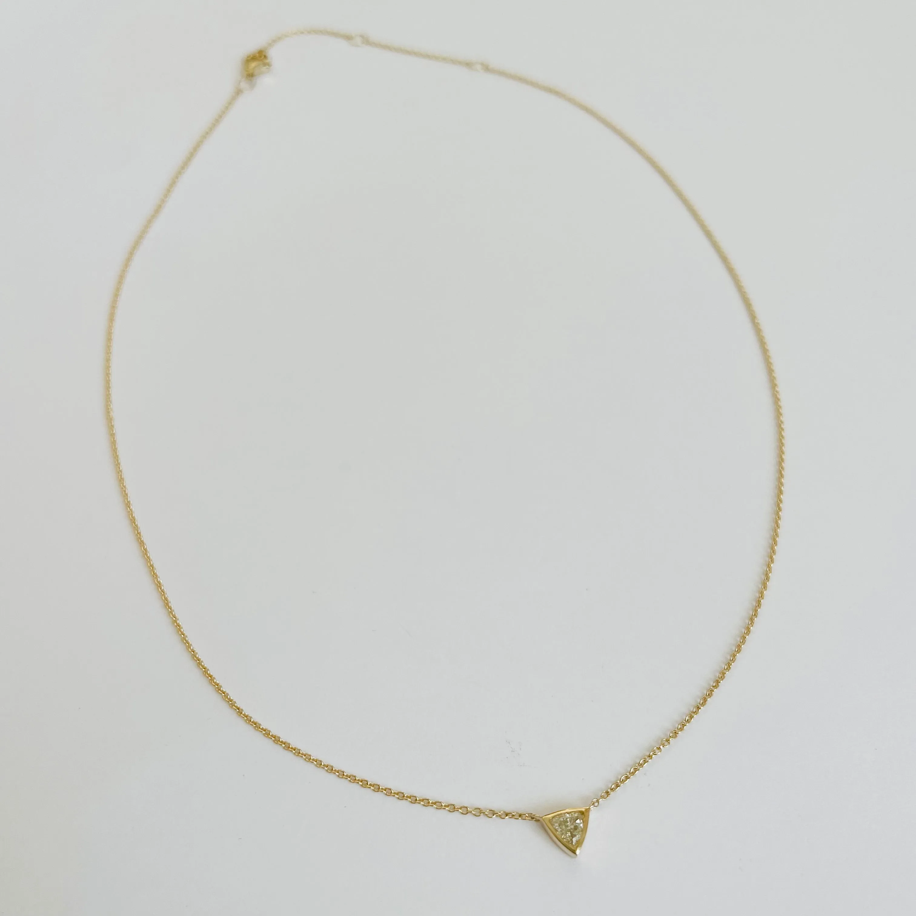 triangle diamond on gold chain sold by Theodosia