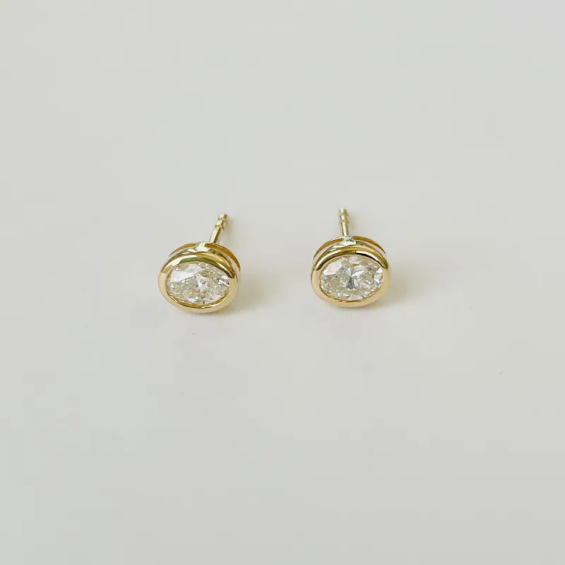 bezel set oval diamond studs sold by Theodosia