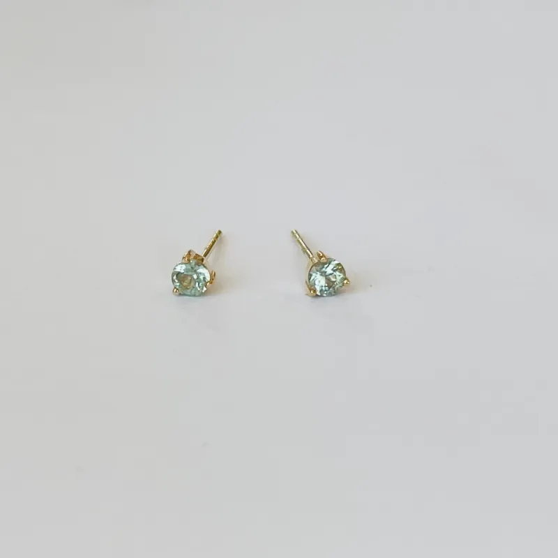 blue topaz prong set studs sold by Theodosia