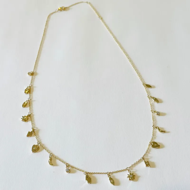 gold charm necklace sold by Theodosia