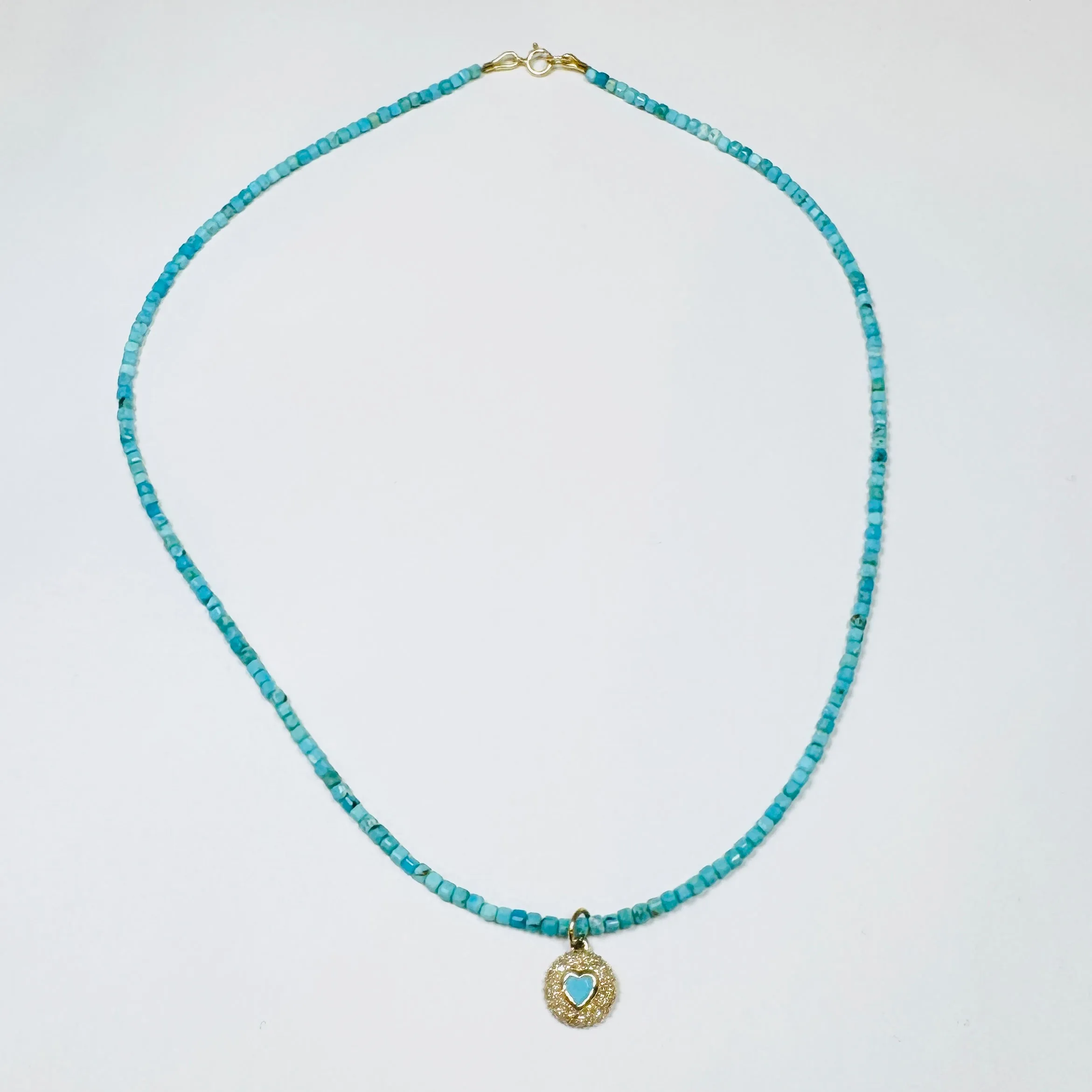 delicate block turquoise necklace with dome heart charm sold by Theodosia