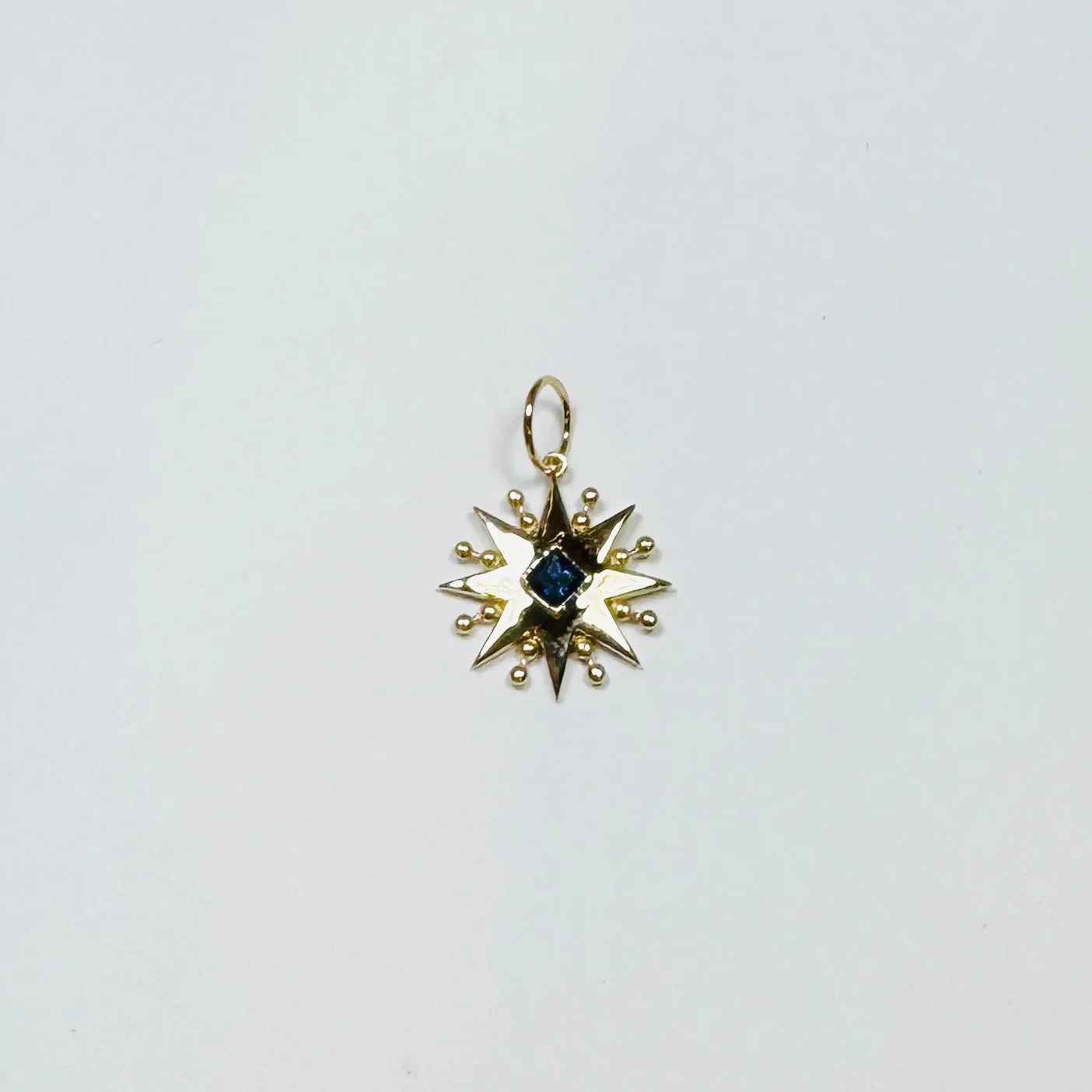 blue sapphire starburst pendant sold by Theodosia