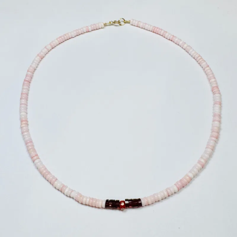 pink conch, garnet, and red diamond barrel necklace made by Theodosia