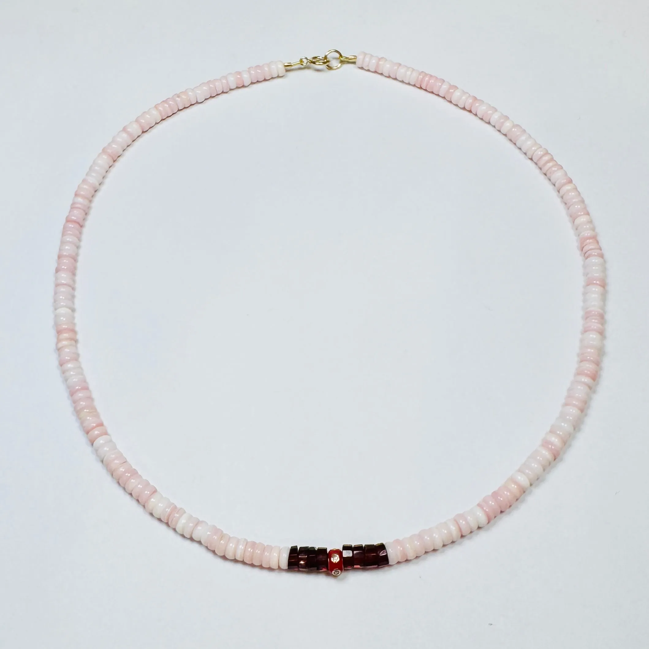 pink conch, garnet, and red diamond barrel necklace sold by Theodosia
