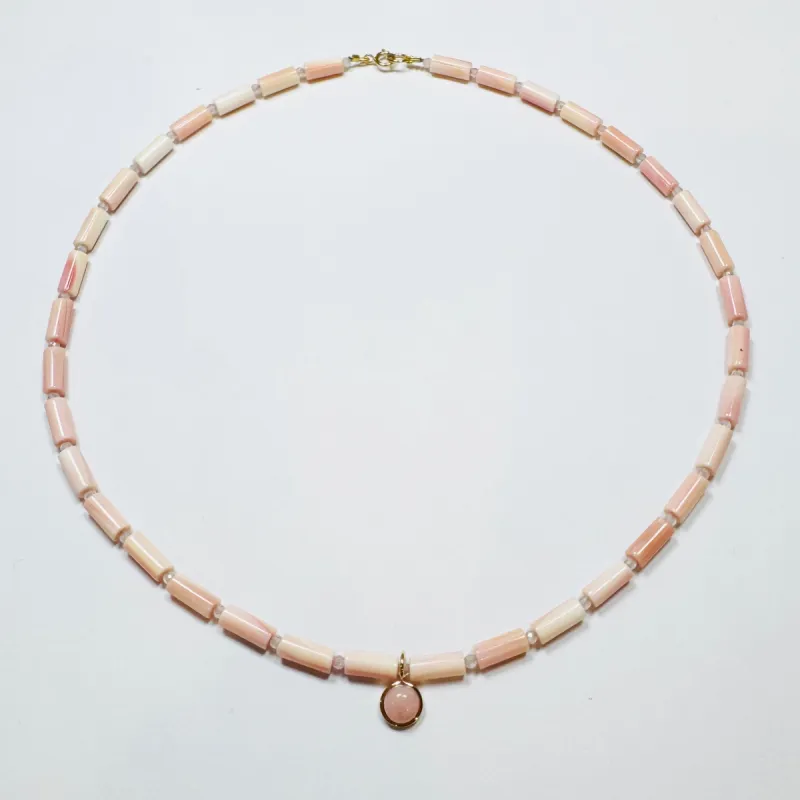 tube pink conch necklace with opal charm sold by Theodosia