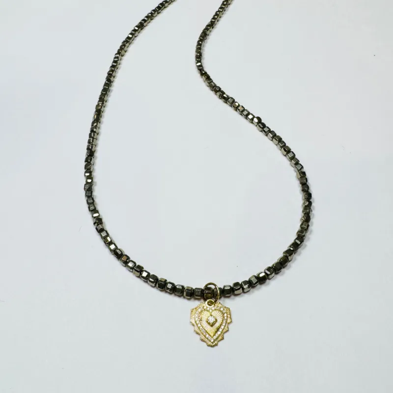 delicate block pyrite necklace with doily heart charm sold by Theodosia