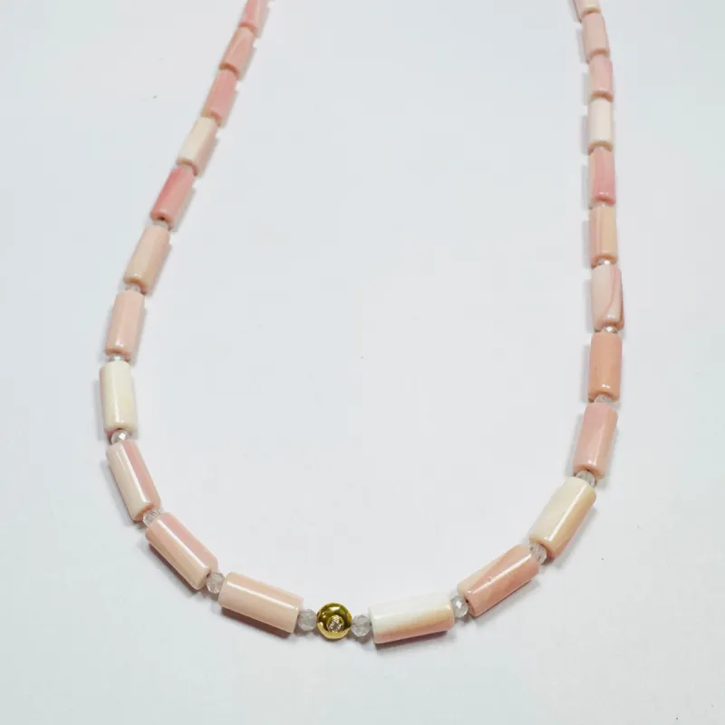 tube pink conch necklace with diamond bead sold by Theodosia