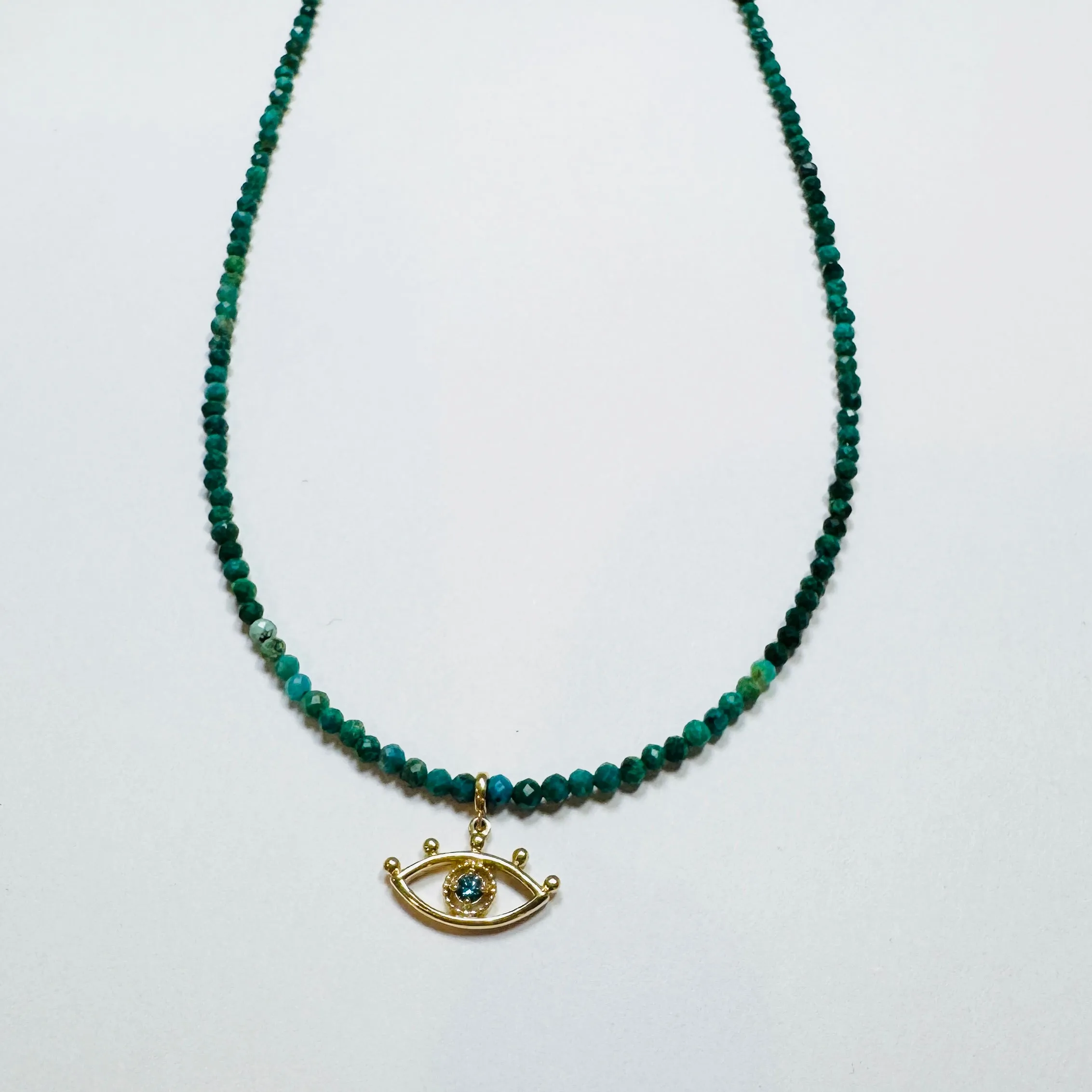 evil eye on chrysocolla sold by Theodosia
