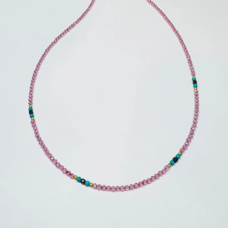 Pink sapphire necklace with turquoise, ruby, and gold nuggets sold by Theodosia