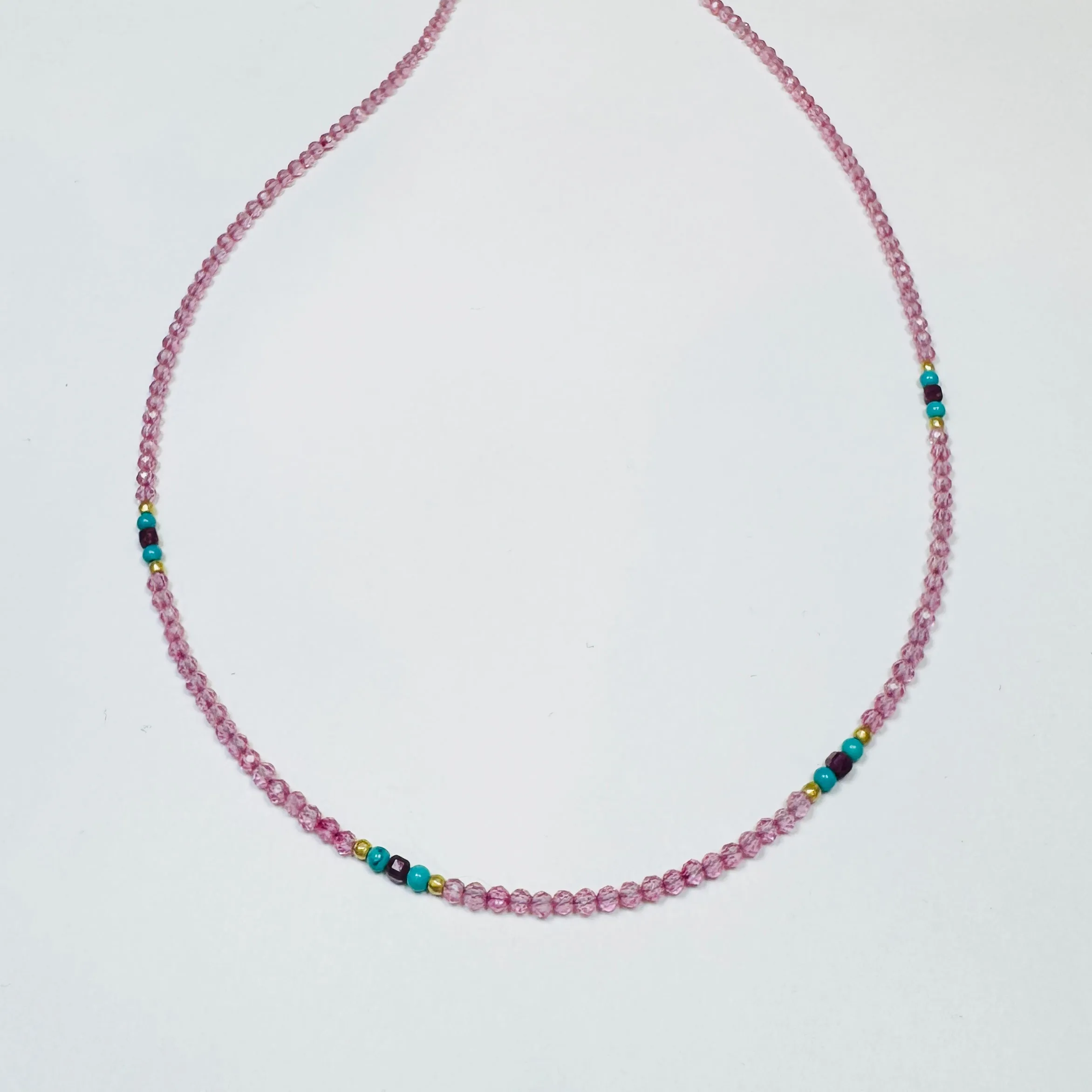 Pink sapphire necklace with turquoise, ruby, and gold nuggets sold by Theodosia