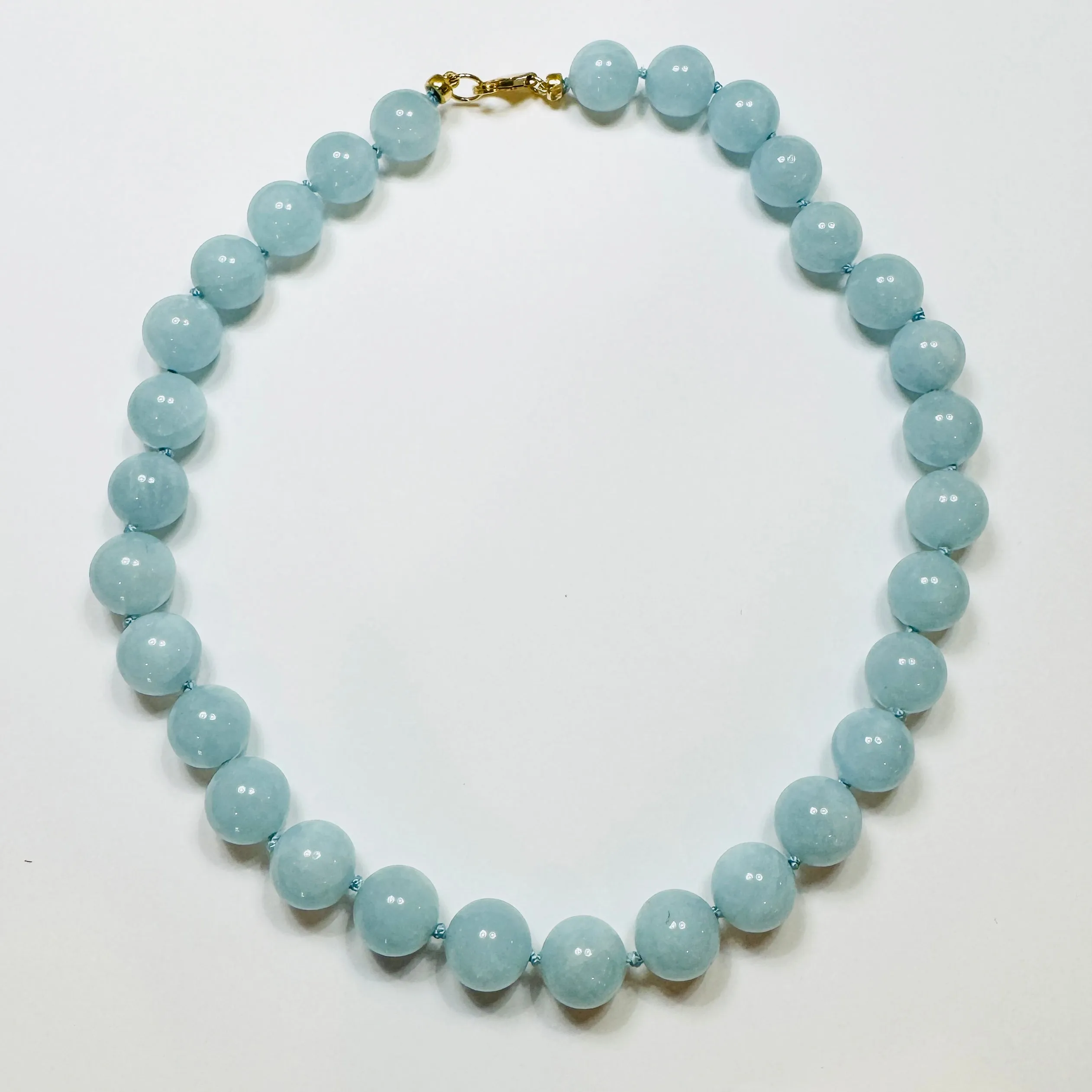 knotted gumball aquamarine necklace sold by Theodosia