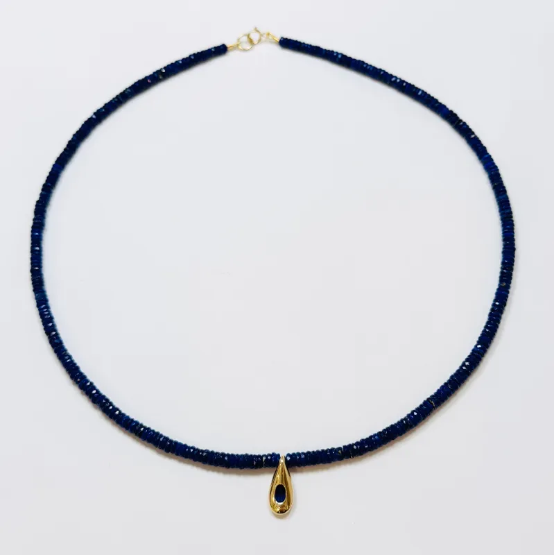 blue sapphire teardrop on lapis heishi sold by Theodosia