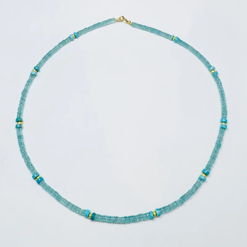 blue apatite heishi necklace with turquoise and gold beads sold by Theodosia