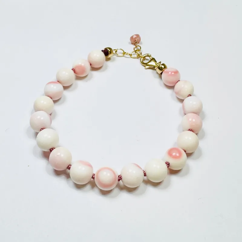 pink conch knotted bracelet made by Theodosia
