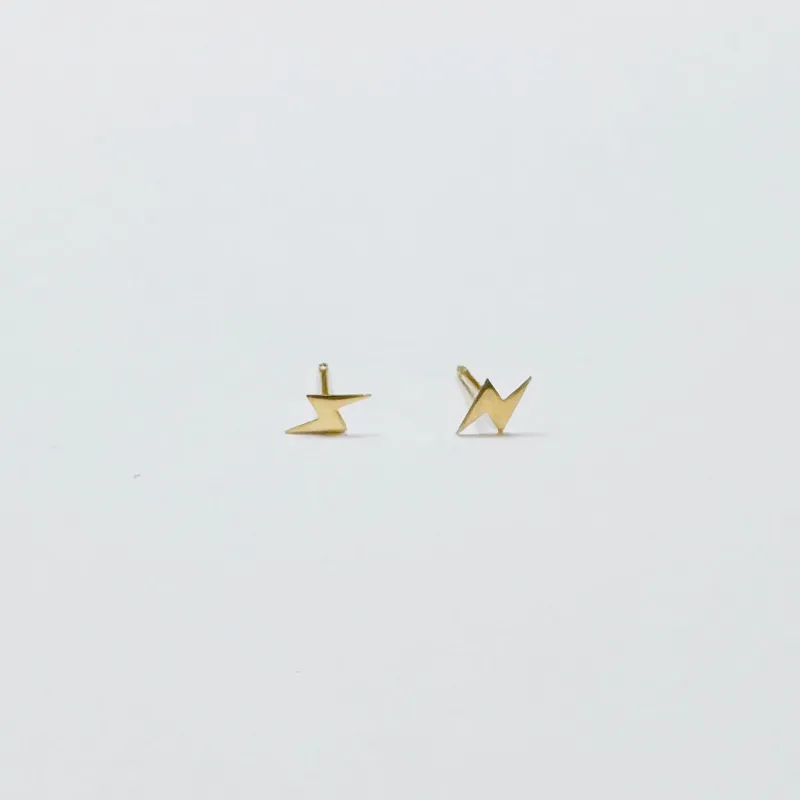 mini gold lightning bolt studs sold by Theodosia