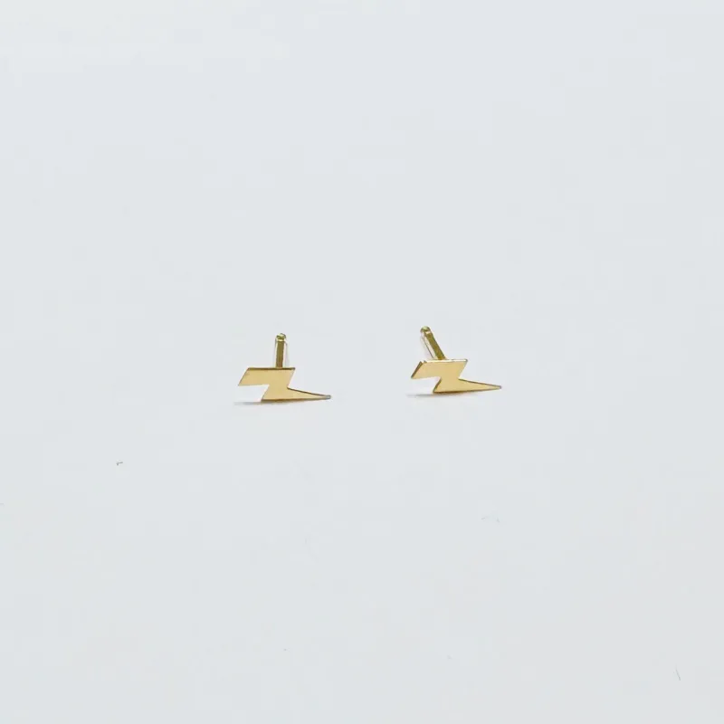 mini gold lightning bolt studs sold by Theodosia
