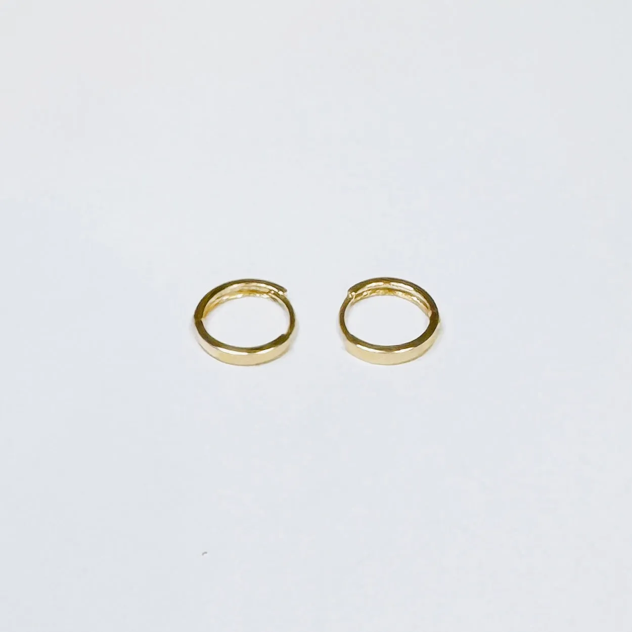 small flat ribbon huggie sold by Theodosia