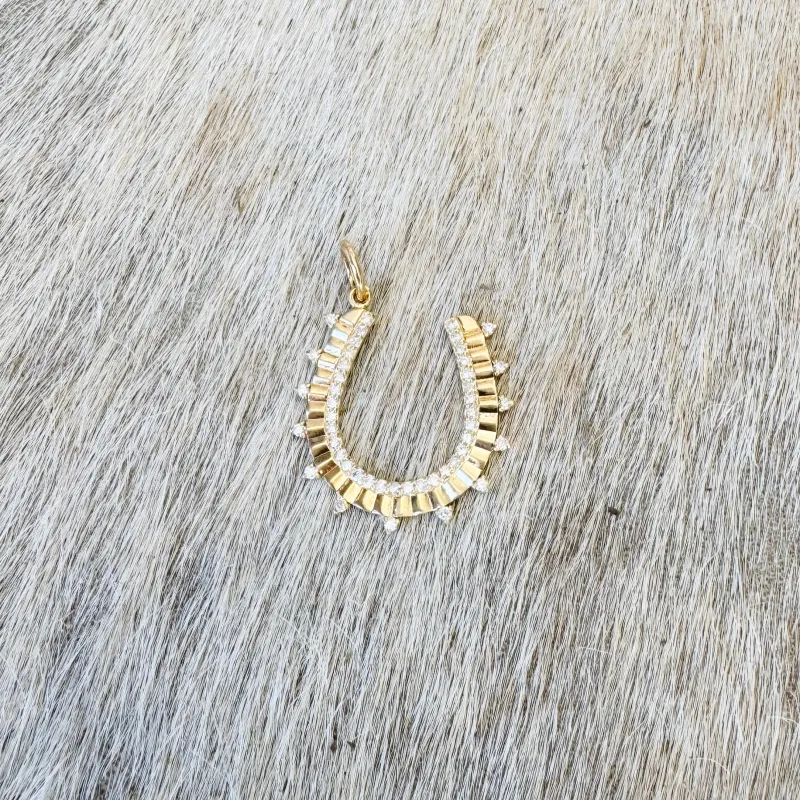 spikey horseshoe pendant sold by Theodosia
