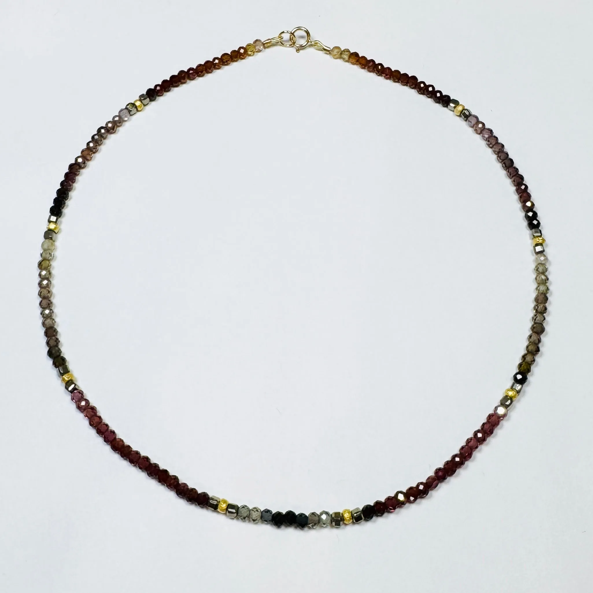 spinel with pyrite and gold beads sold by Theodosia