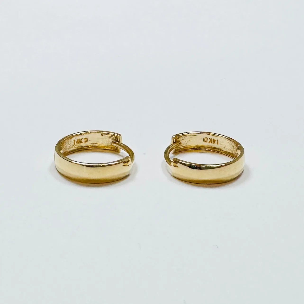 simple gold hoops sold by Theodosia