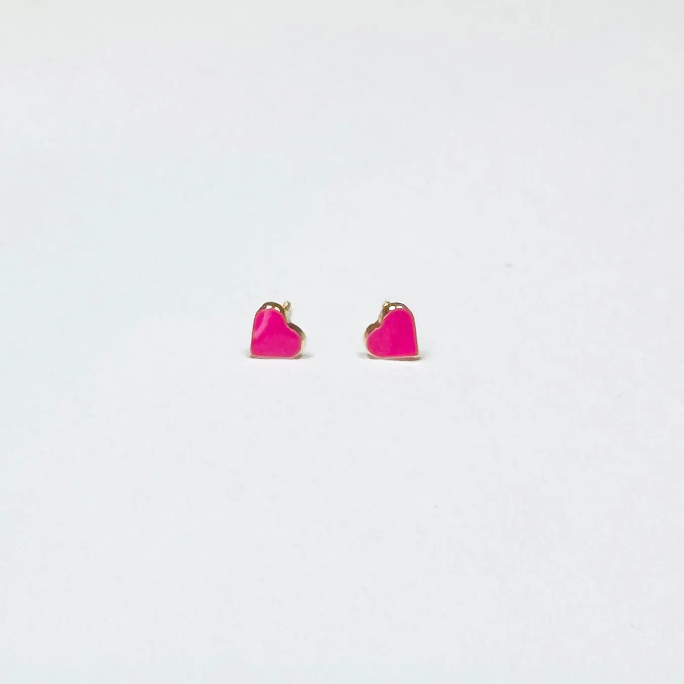 mini hot pink enamel heart studs sold by Theodosia